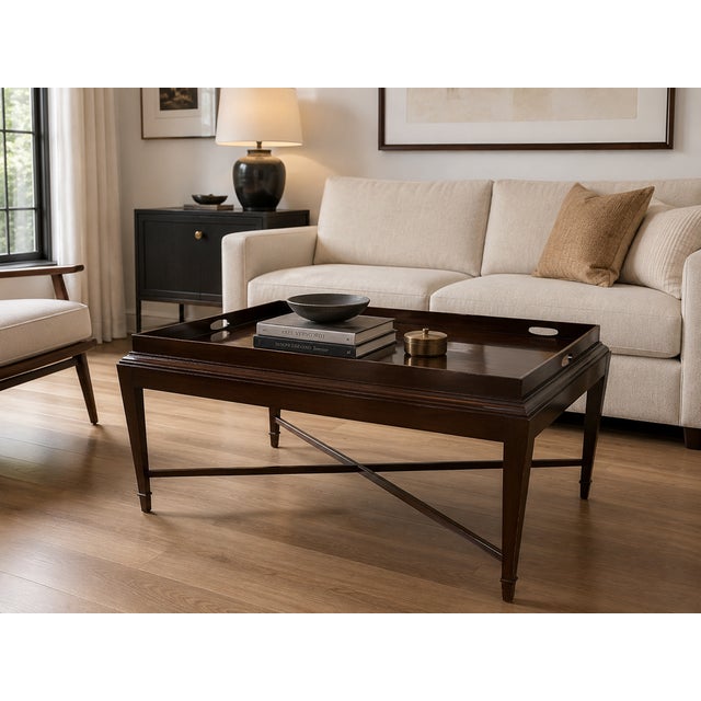 Designed by renowned designer Barbara Barry for Baker Furniture, this elegant mahogany coffee table embodies Barry’s...