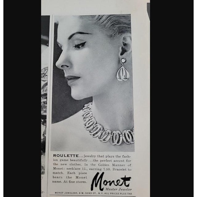 Goldtone interlocking ovals link necklace with hook clasp. Marked "MONET" on the hangtag with "© ©" on the back of the...