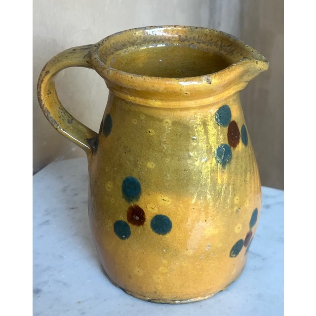 This antique handmade French redware bowl was made Savoie region of France from 1880-1920. It has a rich brown background...