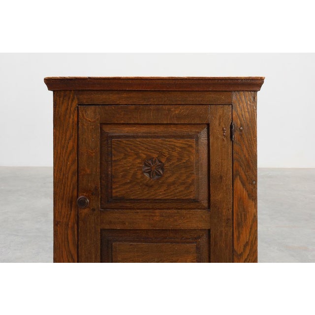This charming Belgian oak cabinet, dating from the 17th century, exemplifies the enduring appeal of rustic craftsmanship....