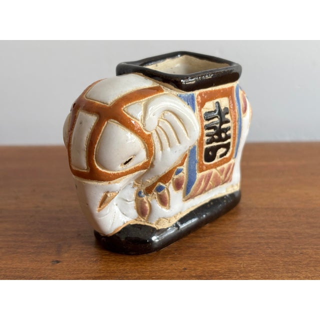 Tiny ceramic elephant garden stool shaped vessel, perfect for holding toothpicks, matches, or even an air plant. Please...