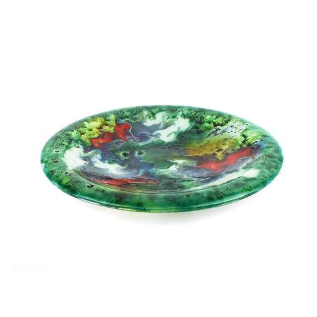 This striking centerpiece bowl is an authentic example of fused art glass from the renowned Nahariya Glass studio in...