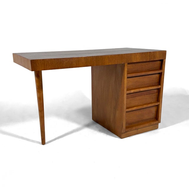 This desk by T.H. Robsjohn-Gibbings for Widdicomb has a strong architectural quality and great minimalist design. The...