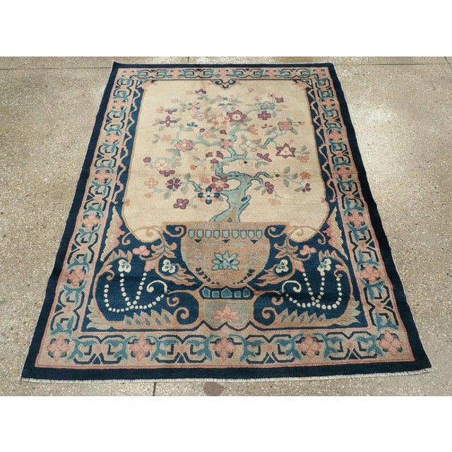 A vintage Chinese Art Deco accent rug handmade during the mid-20th century. Measures: 4' 0" x 5' 6"