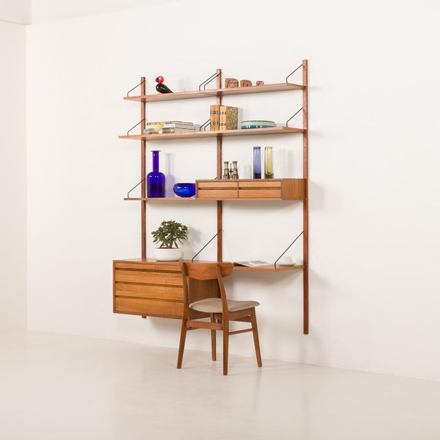 Danish walnut home office shelving system designed by poul cadovius and made by his company cado, 1960s. It is an entirely...