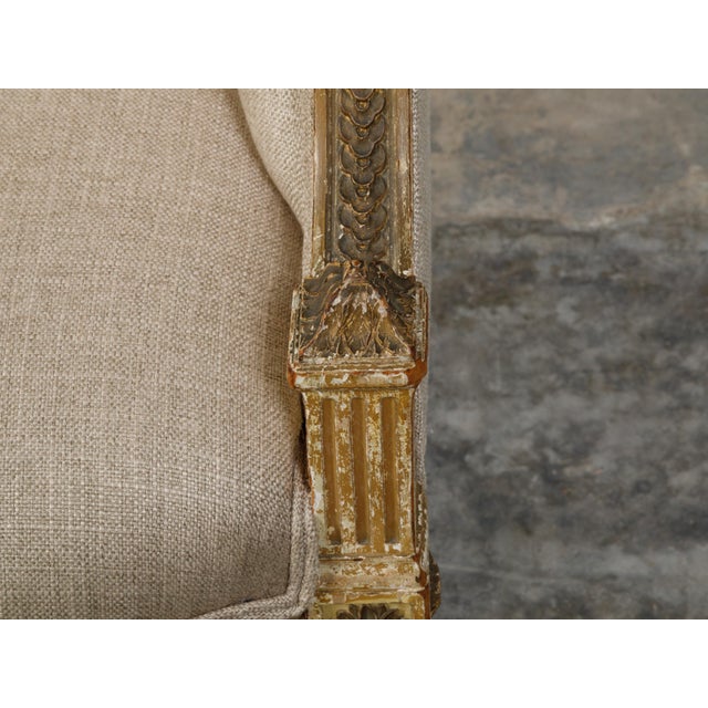 French 19th Century Louis XVI Style Giltwood Wingback Settee with Carved Motifs For Sale - Image 10 of 10