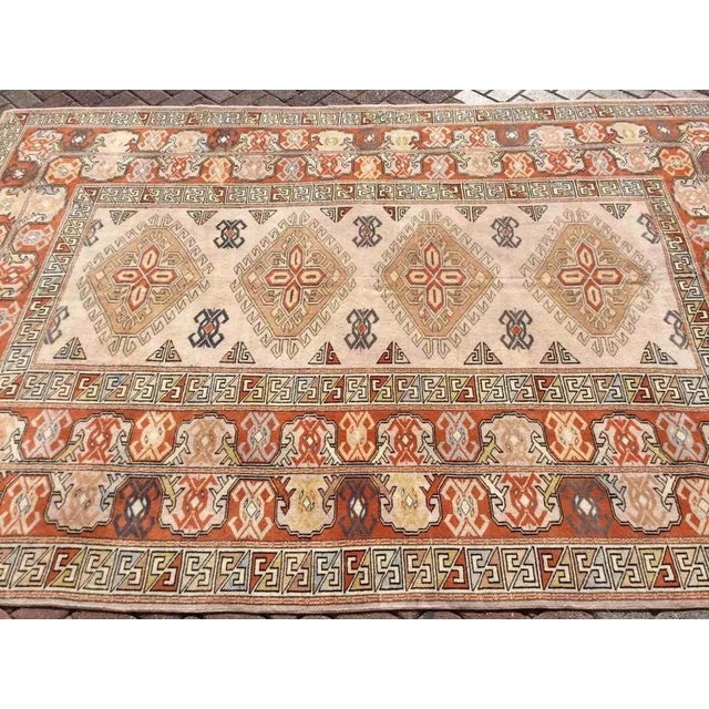 This gorgeous Hand knotted Vintage Anatolian area rug is approximately 60 years old in excellent vintage condition. The...