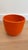 Add a pop of color and iconic design to your indoor or outdoor decor with this vibrant orange Gainey Pottery planter. The...