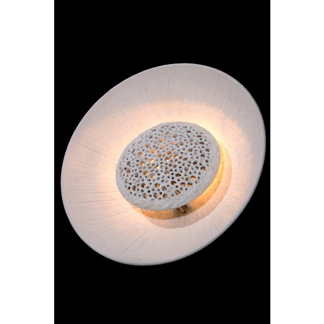 This stunning wall lamp, crafted in the 1960s by the small Sejer Keramik pottery on the Danish island of Funen, is a...