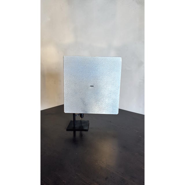 Model 611/g table lamp designed by Gino Sarfatti for Arteluce in 1973. Made with a reflective shade in polished Renal...
