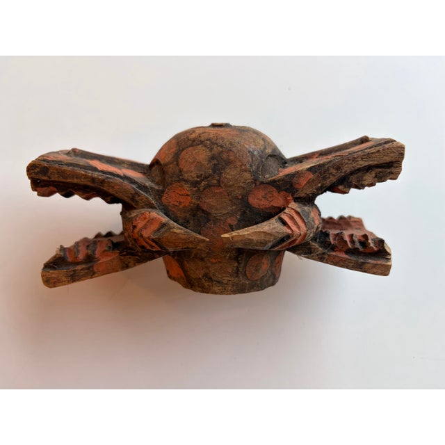Traditional hand-carved West African architectural ornament or ceremonial fitting carved from a single piece of...