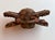 Traditional hand-carved West African architectural ornament or ceremonial fitting carved from a single piece of...