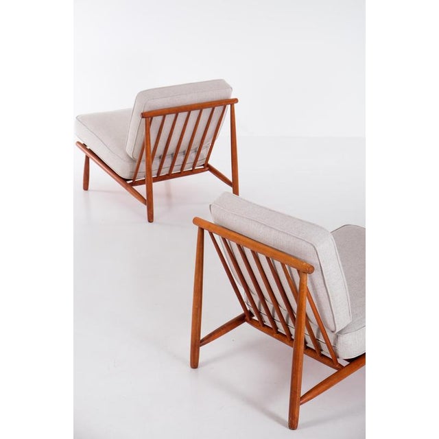 Model Domus designed by Alf Svensson. Produced by DUX, Sweden, 1950s. Newly reupholstered cushions. This piece is...