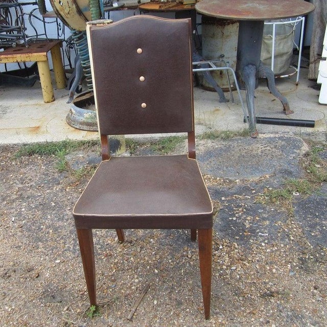 A set of eight vintage Italian high back dining chairs. These chairs feature leather upholstery for the seats and...