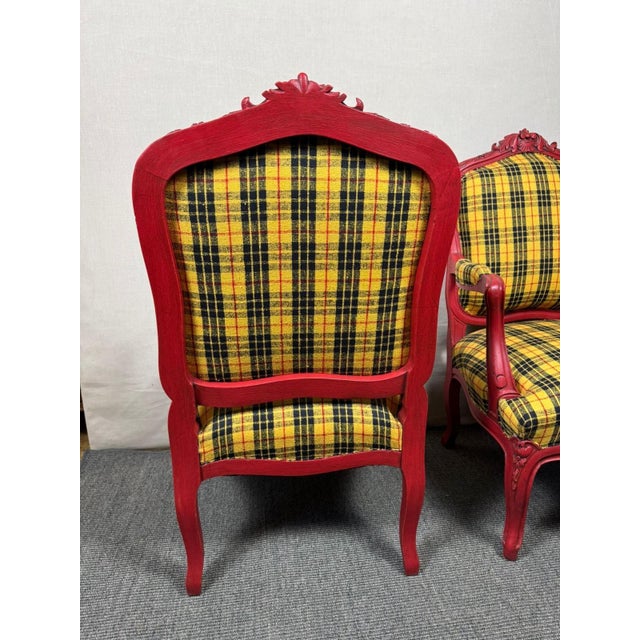 This pair of 19th century style armchairs have been lacquered red and distressed black to make a sophisticated contrast...