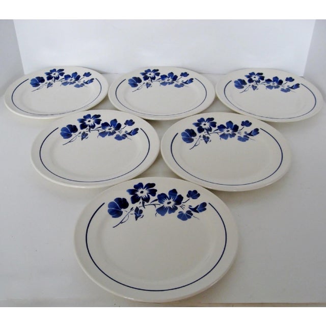 Set of 6 French stoneware salad plates in white glaze with bright cobalt nasturtiums and border decoration. Made by...