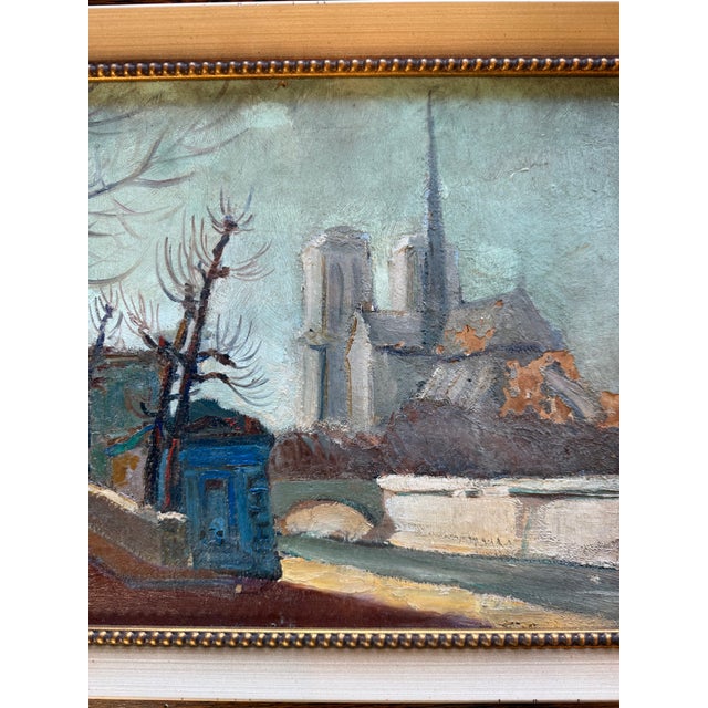 Painting depicting a charming European street scene with bare trees, buildings, and a church in the background. Soft...