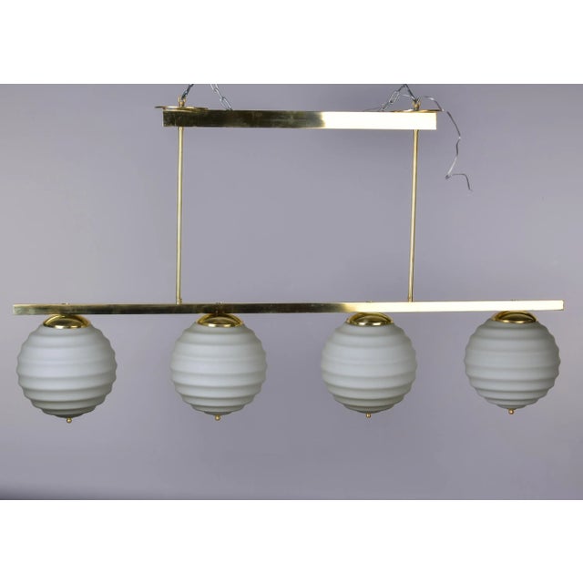 Mid-Century Modern New Italian Fixture With 4 Pale Taupe Globes on Horizontal Brass Bar For Sale - Image 3 of 12