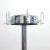 A large and heavy chromed coat rack and umbrella stand from Rosconi featuring several hooks for hanging clothes in the...