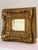 Magnificent antique Baroque Revival beveled mirror with a wide and deep, profusely carved giltwood frame, circa 1860s. The...