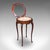 This is a small antique bijouterie table. An English, mahogany and glass display case, dating to the Edwardian period,...