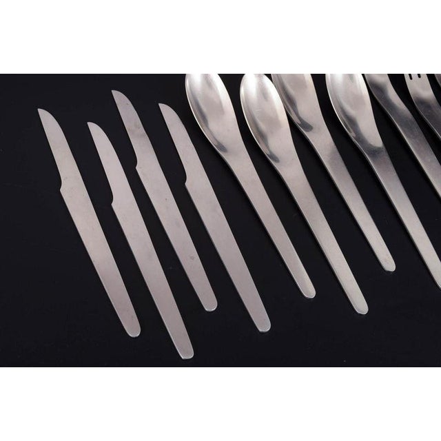 Arne Jacobsen for Anton Michelsen, complete dinner service for four persons. Complete stainless steel dinner cutlery...