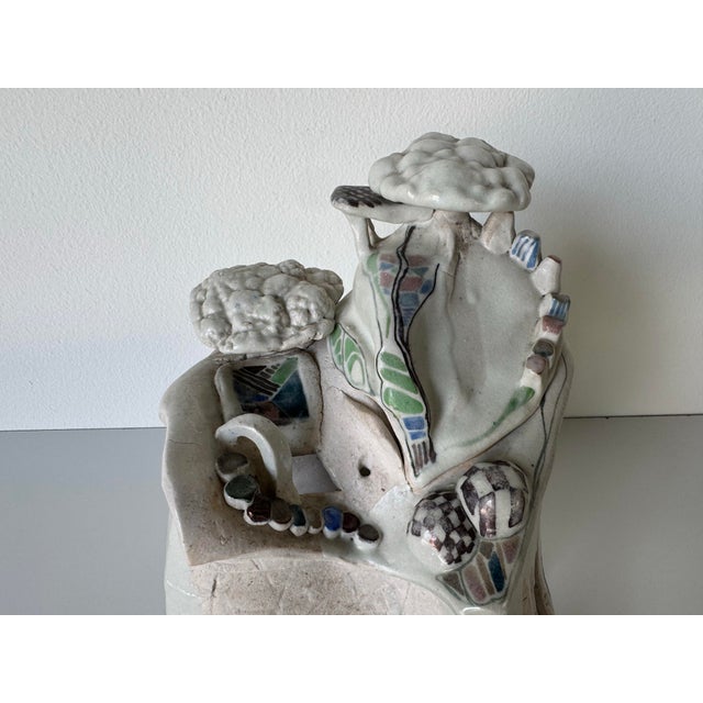 This imaginative 1980s vintage sculptural art pottery piece presents a fantastical miniature landscape in hand-built...