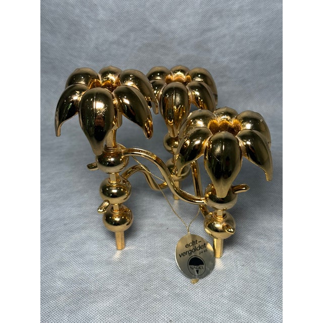 A rare three-arm "Palm" candle holder by Nagel, made in Germany during the 1970s. Featuring sculptural flower- or palm-...