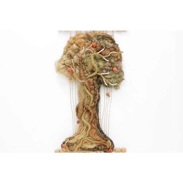 This vintage tree wall tapestry was produced in the 1960s.
