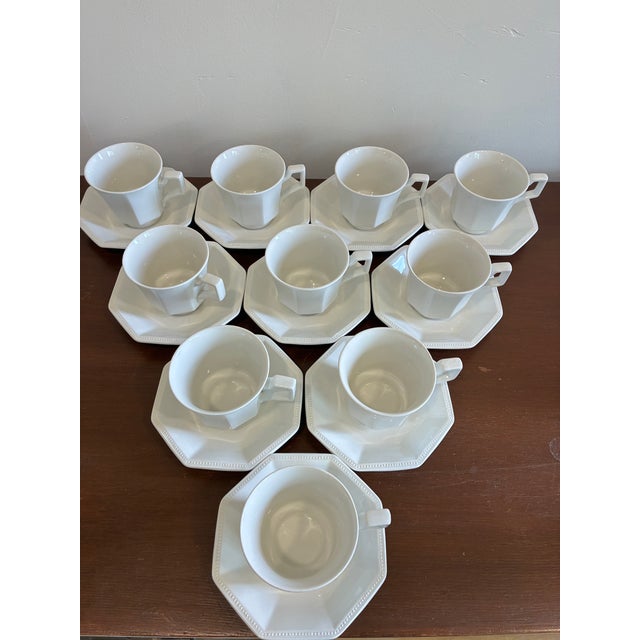 A beautiful set of vintage Johnson Brothers Heritage cups and saucers in classic white ironstone. Distinguished by elegant...