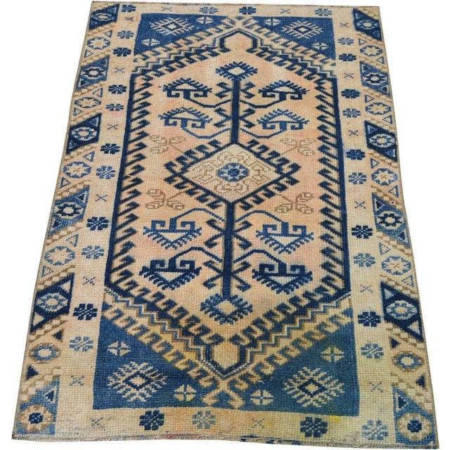 Hand-knotted with care using traditional rug-making techniques, this wool rug blends timeless craftsmanship with a modern...