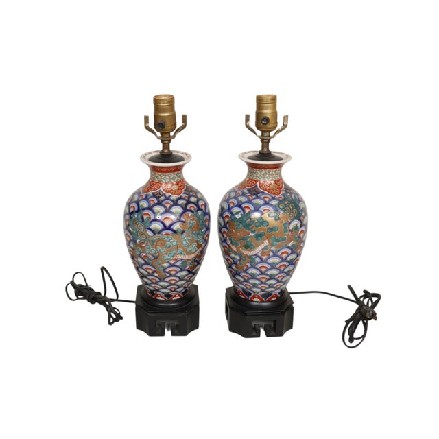 A pair of Japanese vase table lamps. Hand painted with a pair of Komainu guardian lions used to protect against evil...