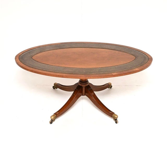 A smart and useful antique Regency style leather top coffee table. This was made in England, it dates from around the...