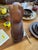 Stunning vintage hand-carved wooden cat figurine featuring smooth, faceted contours and a rich dark wood grain.