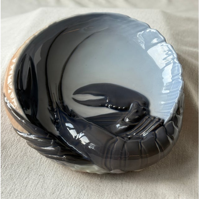 Royal Copenhagen porcelain bowl lobster motif, executed in the manufactory’s characteristic underglaze blue-grey palette....