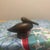 An elegant and organic Mid-Century Modern stylized pelican sculpture, masterfully hand-carved from a rich, highly grained...
