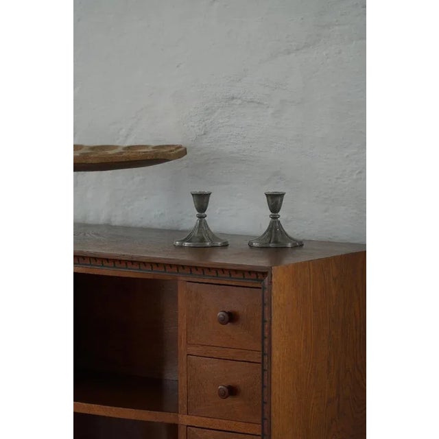 A charming pair of tin candleholders designed by Just Andersen in the 1930s, crafted for candles. These elegant early...