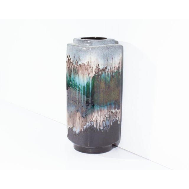 A West German "Polar" ceramic vase produced by Dümler and Brieden. This mid-century ceramic vase stands 14.5" tall and...