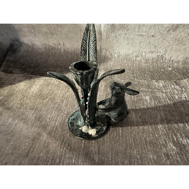 Solid cast bronze or iron sculptural candlestick holder. This little heavy adorable gem has a little bunny, looking up at...