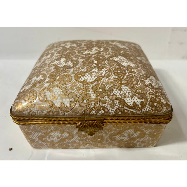 Polychrome porcelain box with gold highlights hand-painted by "le callec in paris" bearing the blue factory mark good...