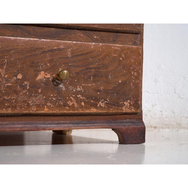 Antique pine bureau chest from Central Europe, dating to around 1900, combining storage functionality with a hybrid design...