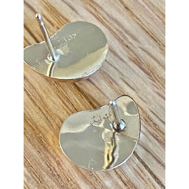 Beautiful marked 14k "comma" or "bean" stud earrings. One small area of separation, and light surface imperfections; both...