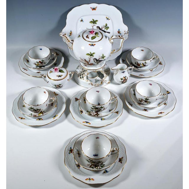Herend service consisting of 23 parts: 1 lidded tea pot, 1 tea warmer with burner, 1 creamer, 1 lidded sugar bowl, 6 cups,...