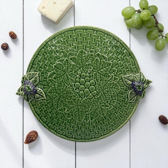 Add a touch of authentic Portuguese charm to your table with this stunning ceramic serving platter from the renowned...