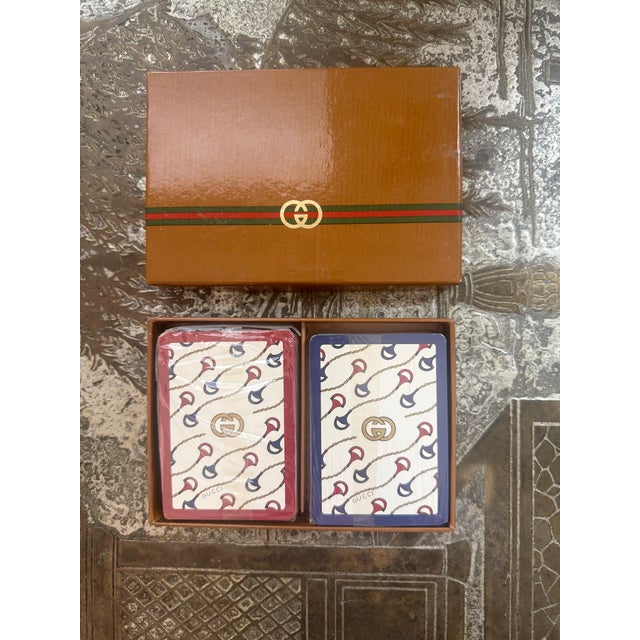 New dead stock vintage GUCCI playing cards. Two decks. Never used. Gucci horsebit design with " Gucci Italy " on each card.