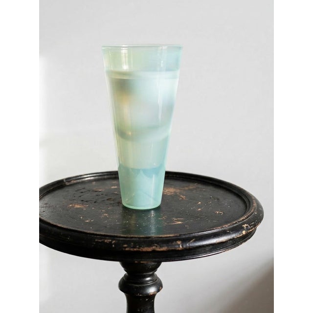 Magnificent large hand-blown opaline blue glass vase, featuring subtle internal rings formed during the glassmaking...