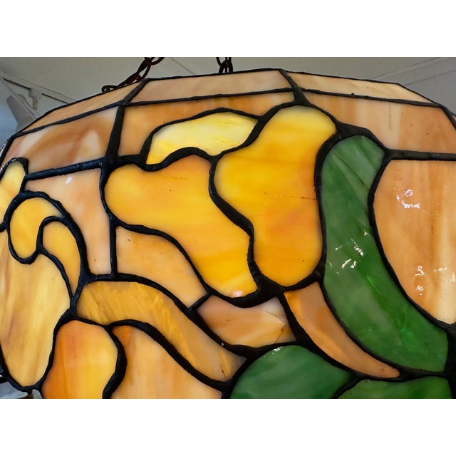 Beautiful leaded glass Tiffany style chandelier in earth colors with a glowing effect. Canopy included 2 lights 18” Chain