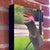 Contemporary A Walk in the Park by Josh Talbott | Acrylic on Canvas Dinosaur in a park setting. For Sale - Image 3 of 4