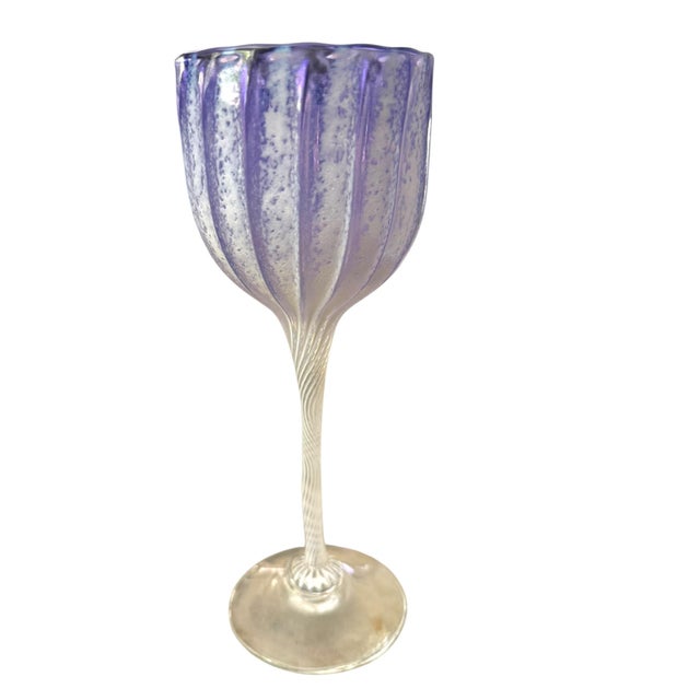 An exceptional set of seven hand blown art glass wine goblets attributed to the celebrated American glass artist Cam...
