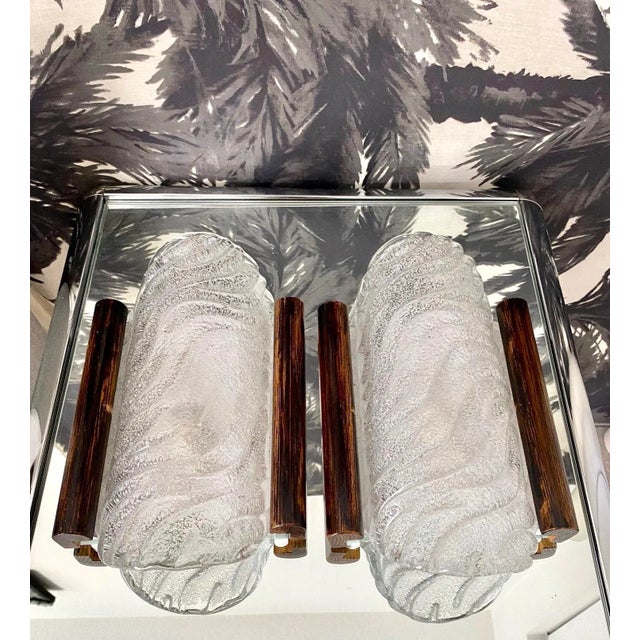 Pair of Mid-Century Modern Barovier & Toso Murano glass sconces. The wall lights are comprised of handblown curved glass...